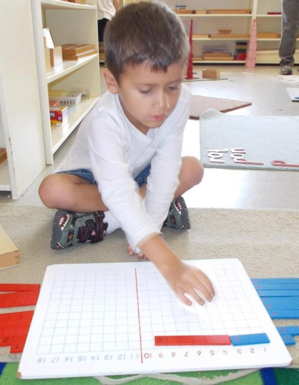 Little Boy Playing with Math Blocks